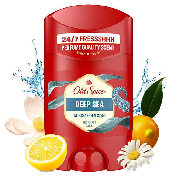 Old Spice Deep Sea deodorant stick in red packaging labeled ‘24/7 Fresh,’ surrounded by water splashes, lemon, orange, chamomile flower, and other natural fragrance elements