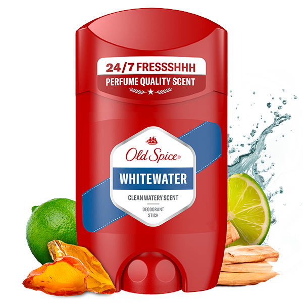 Old Spice Whitewater deodorant stick in red packaging labeled ‘24/7 Fresh,’ with water splashes, lime, wood, and fruit pieces around it to represent fragrance notes.